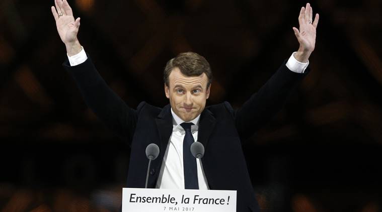 French President-elect Emmanuel Macron gestures during a victory celebration outside the Louvre museum in Paris, France, Sunday, May 7, 2017. Speaking to thousands of supporters from the Louvre Museums courtyard, Macron said that France is facing an immense task to rebuild European unity, fix the economy and ensure security against extremist threats. (AP Photo/Thibault Camus)