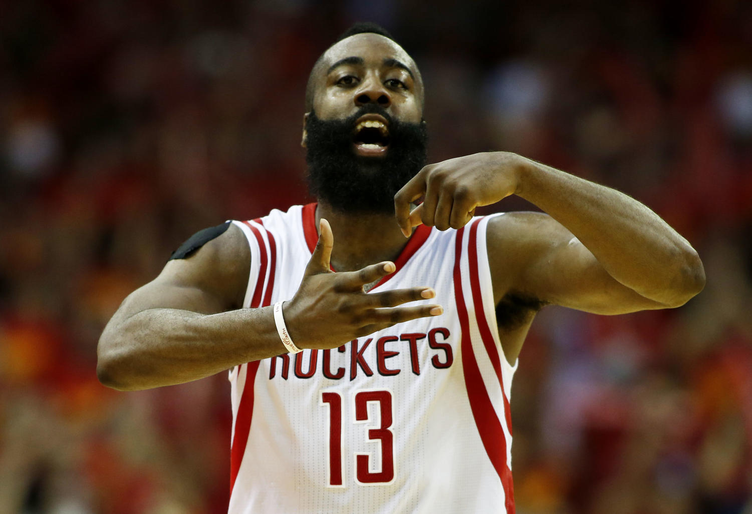 HOUSTON, TX - MAY 17: James Harden #13 of the Houston Rockets celebrates in the fourth quarter against the Los Angeles Clippers during Game Seven of the Western Conference Semifinals at the Toyota Center for the 2015 NBA Playoffs on May 17, 2015 in Houston, Texas. NOTE TO USER: User expressly acknowledges and agrees that, by downloading and/or using this photograph, user is consenting to the terms and conditions of the Getty Images License Agreement. (Photo by Scott Halleran/Getty Images)