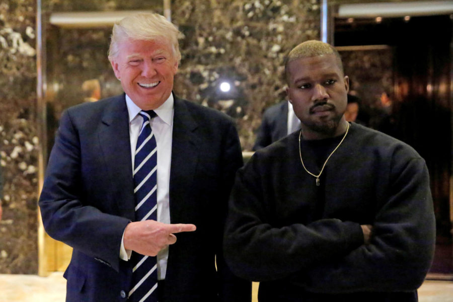 U.S. President-elect Donald Trump and musician Kanye West pose for media at Trump Tower in Manhattan, New York City, U.S., December 13, 2016.  REUTERS/Andrew Kelly      TPX IMAGES OF THE DAY